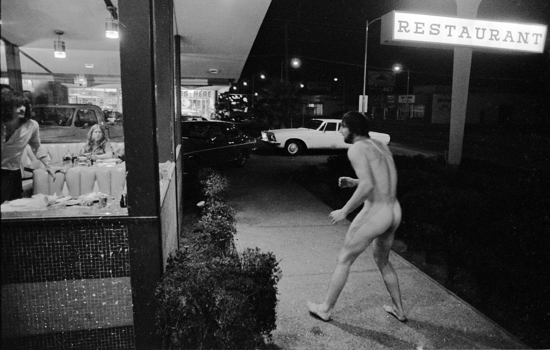 Naked man in restaurant